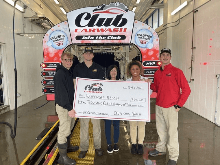 1st capitol check presentaiton in front of car wash entrance