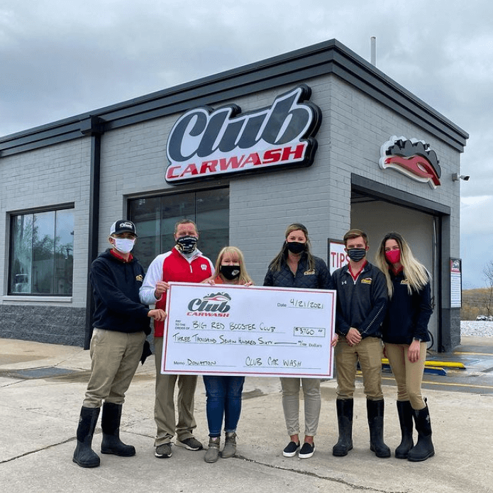 warrenton check presentation in front of car wash